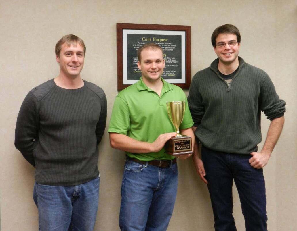 Three men with trophy