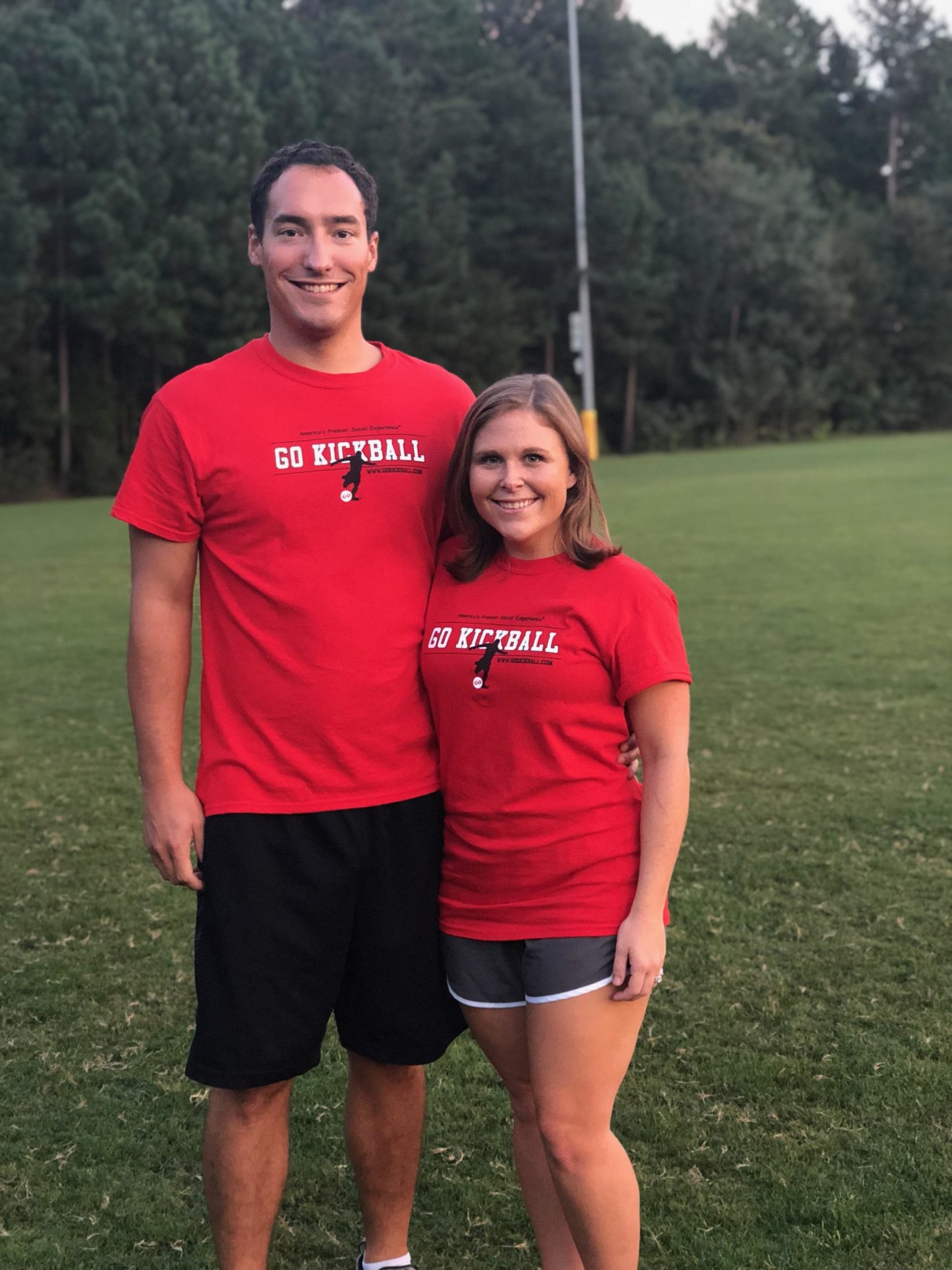 Man and girl in go kickball T-shirts