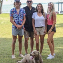 Couple and two grown children with dog