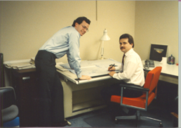 Two men at desk