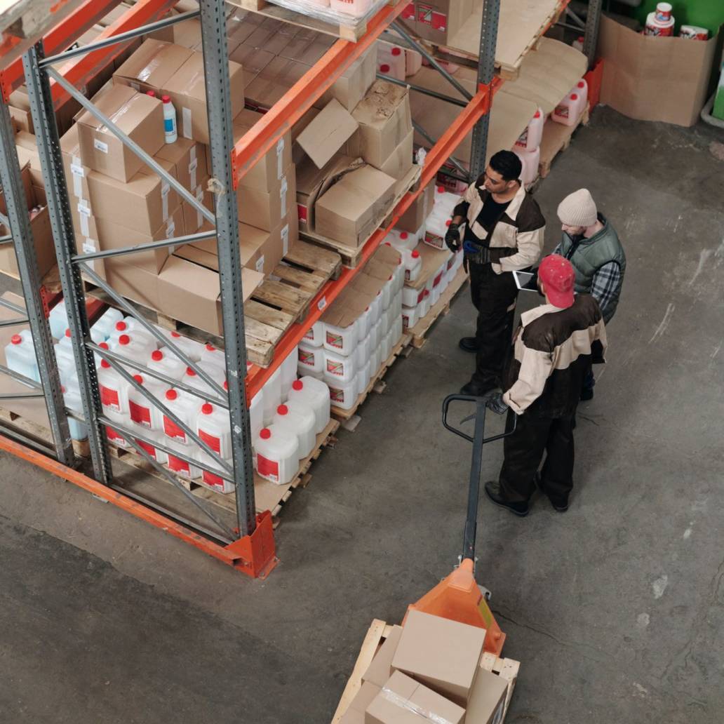 Three people looking at boxes