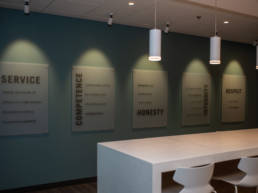 Core values on wall: service, competence, honesty, integrity, respect