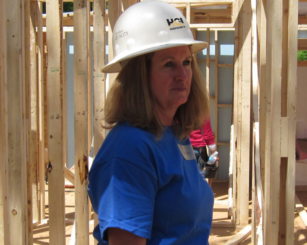 Woman with a construction helmet